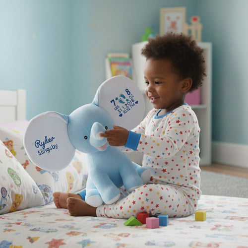 Child enjoying Crumble, the cuddly personalised blue plush elephant