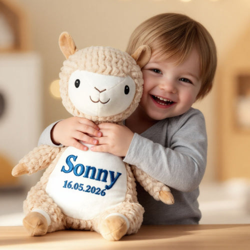 Young girl playing with personalised Allie alpaca plush toy, custom name embroidered cuddly gift for children
