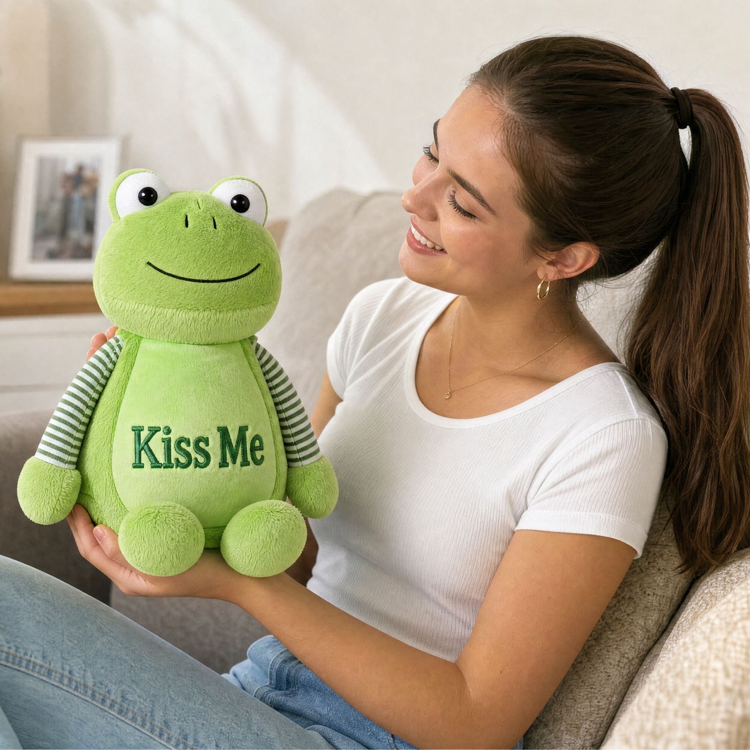 Close-up of Hoppy green frog plush toy with personalised embroidered name