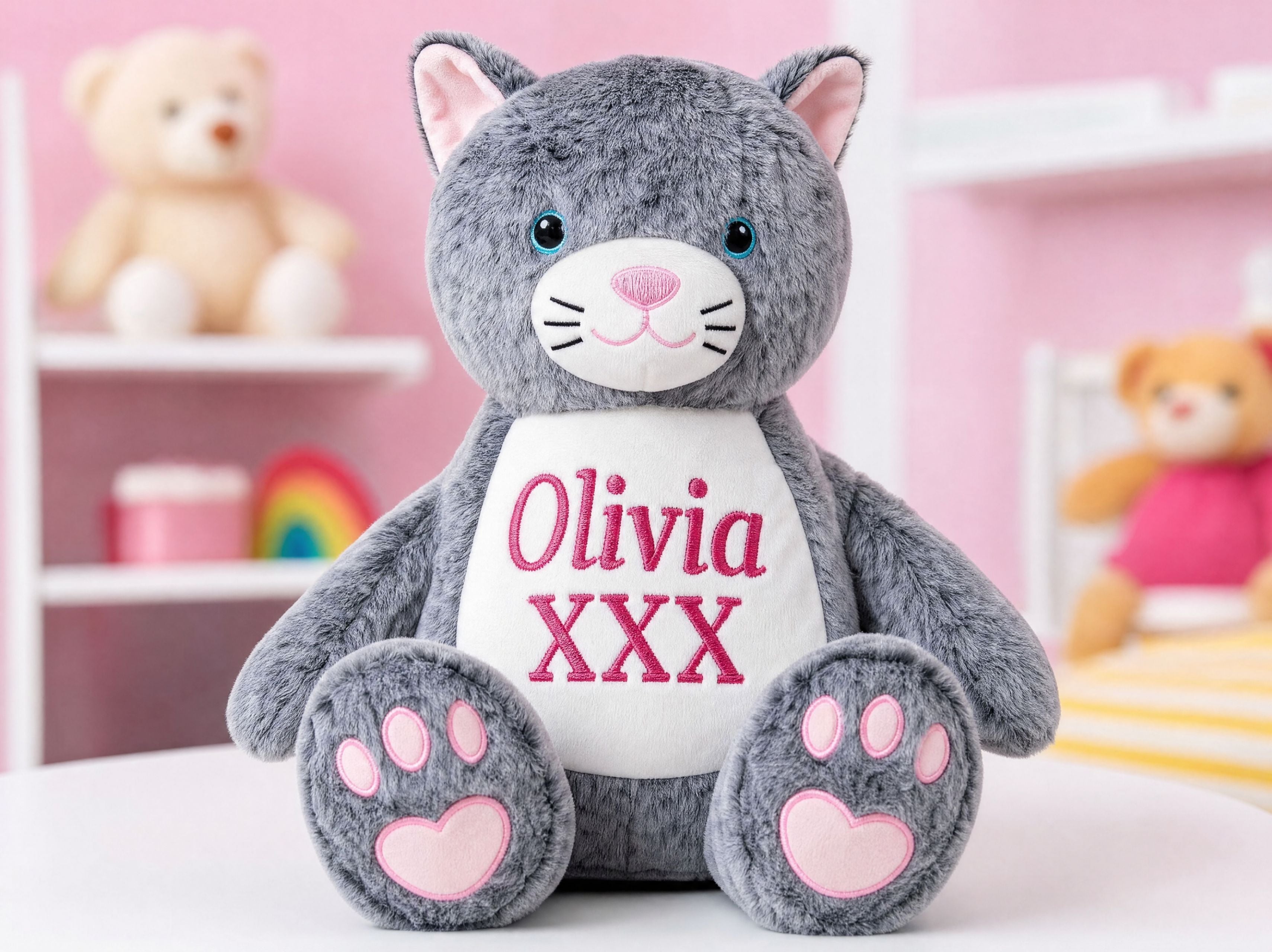 Close-up of Marmalade cat plush toy with personalised embroidered name