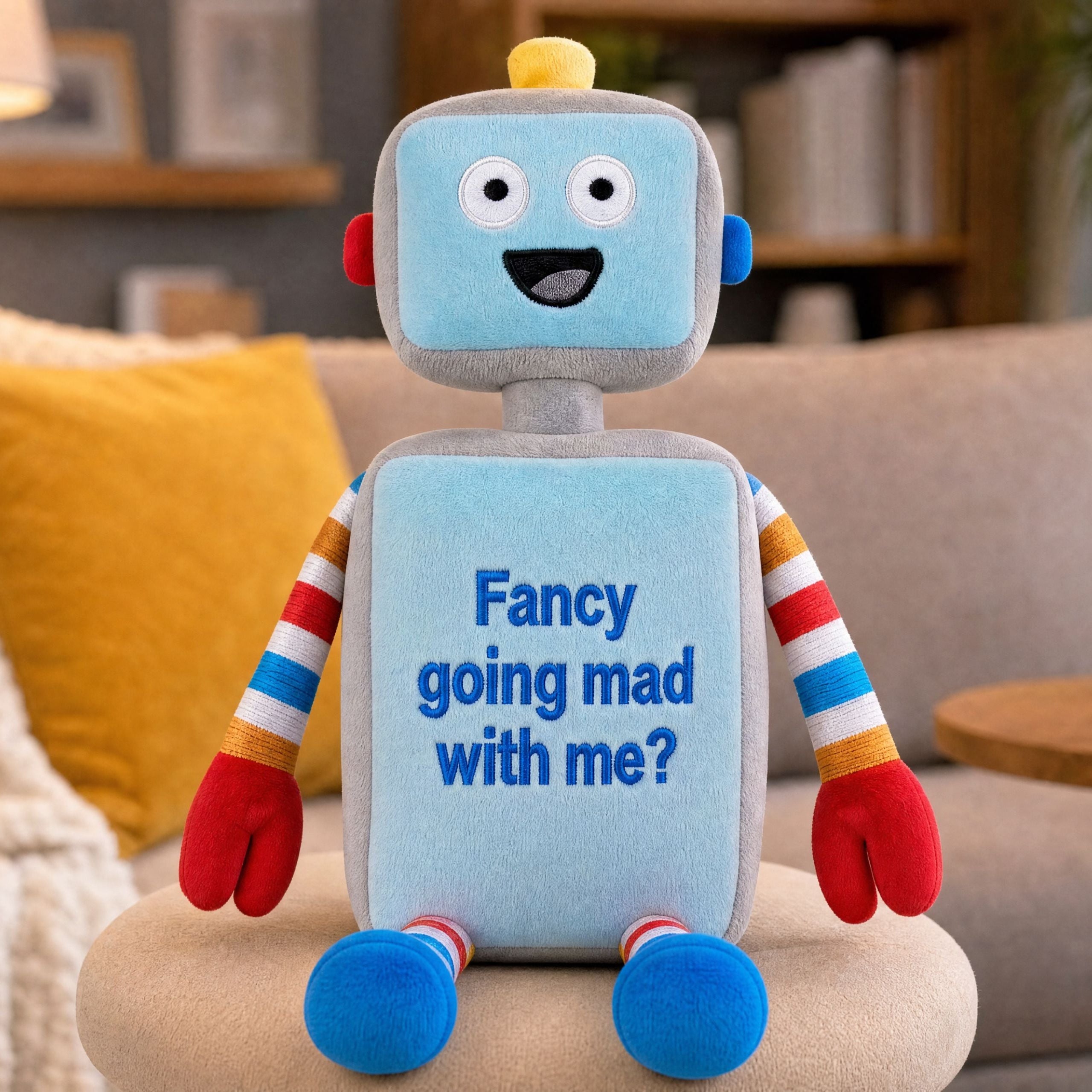 Close-up of personalised robot plush toy with embroidered name