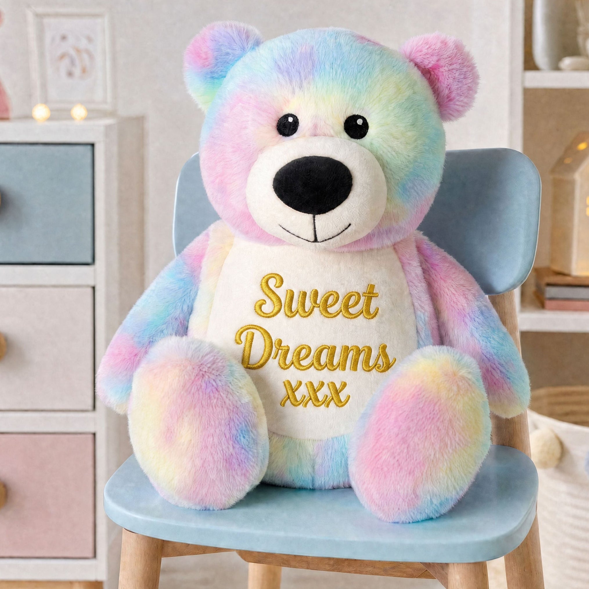 Close-up of colourful personalised tie dye bear with embroidered name