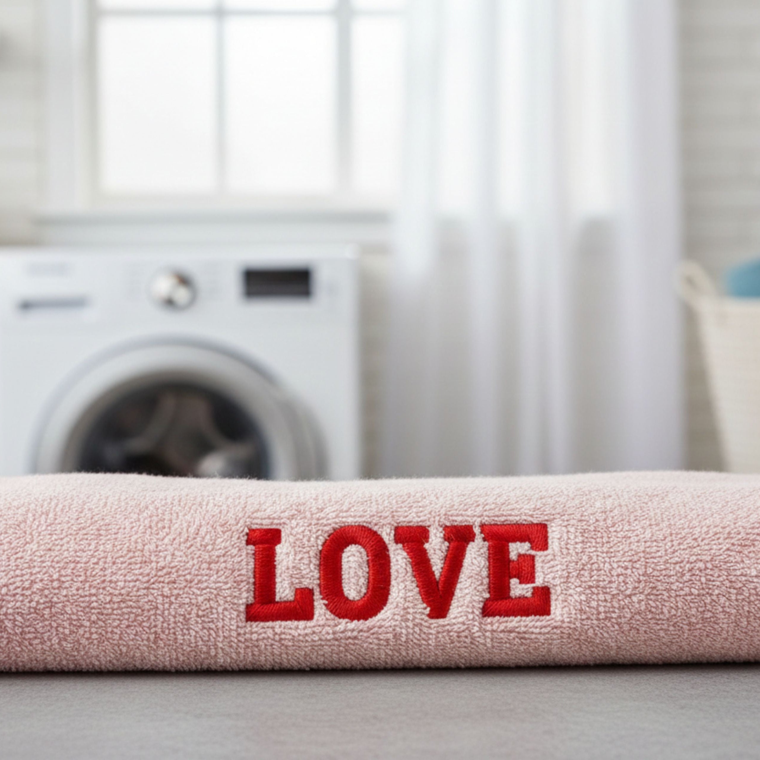 Close-up of embroidered personalised text on cotton towel