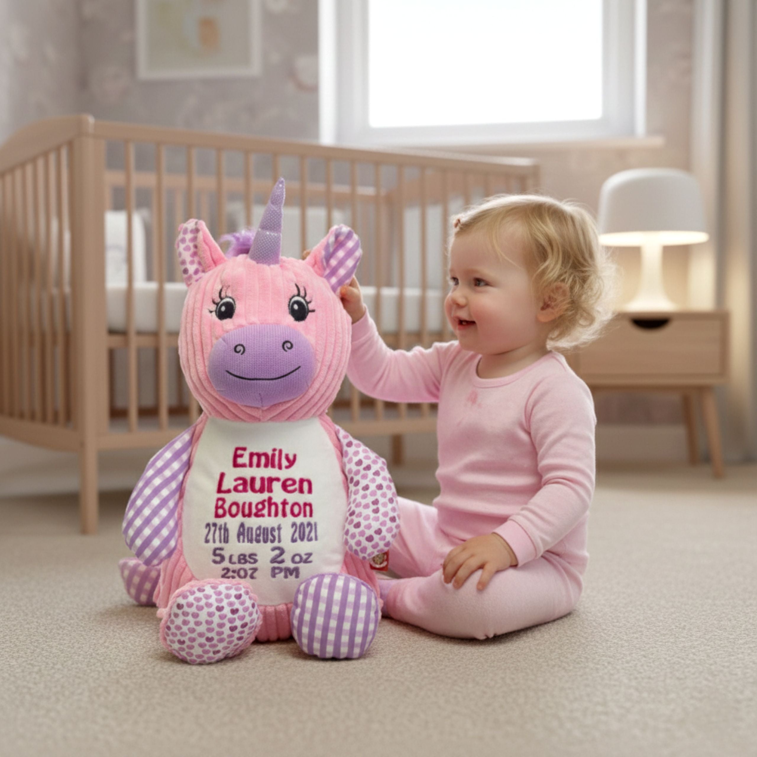 Girl playing with Bella personalised plush sensory unicorn 🦄💖 custom embroidered keepsake toy