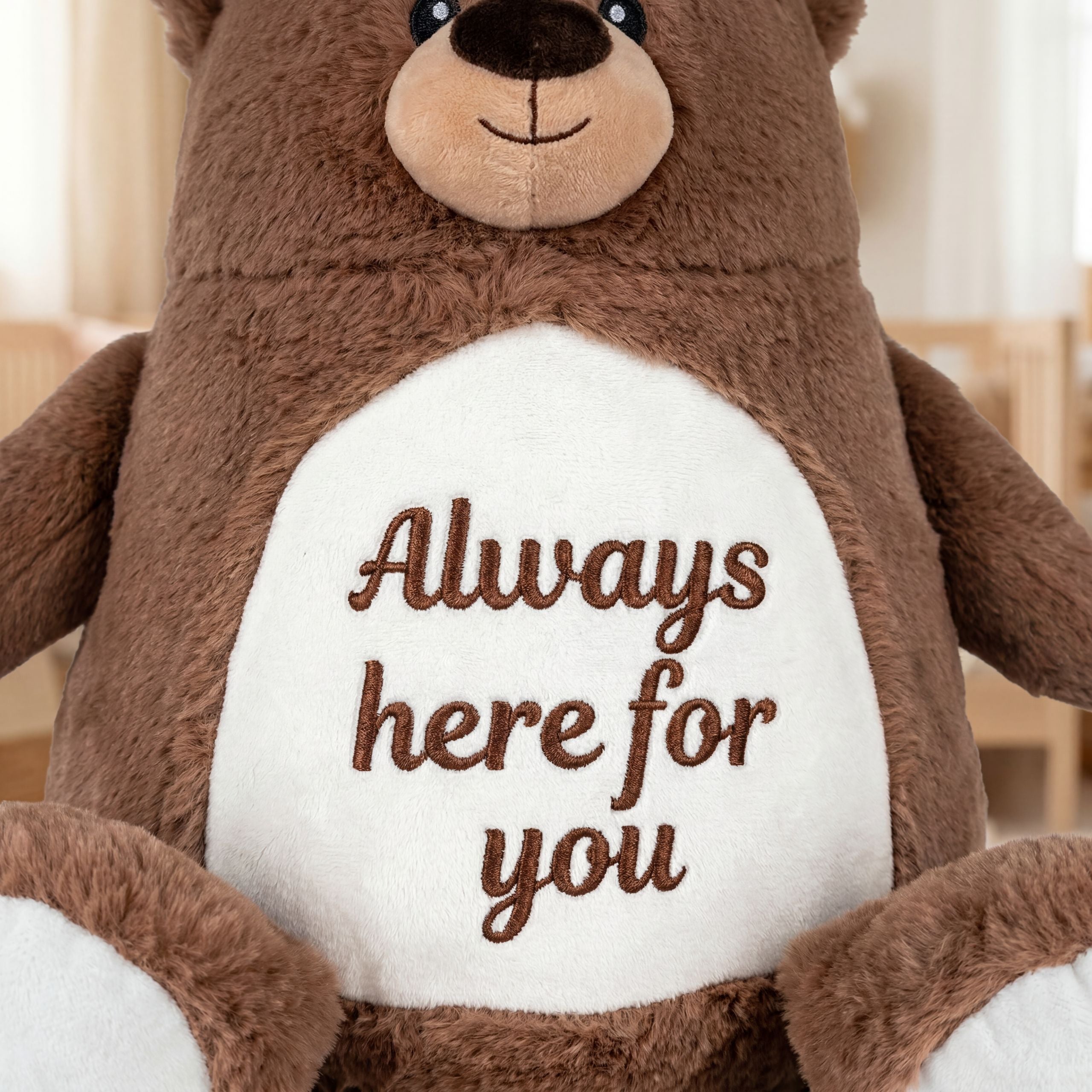 Close-up of the teddy bear’s embroidery, showing precise stitching and premium fabric craftsmanship