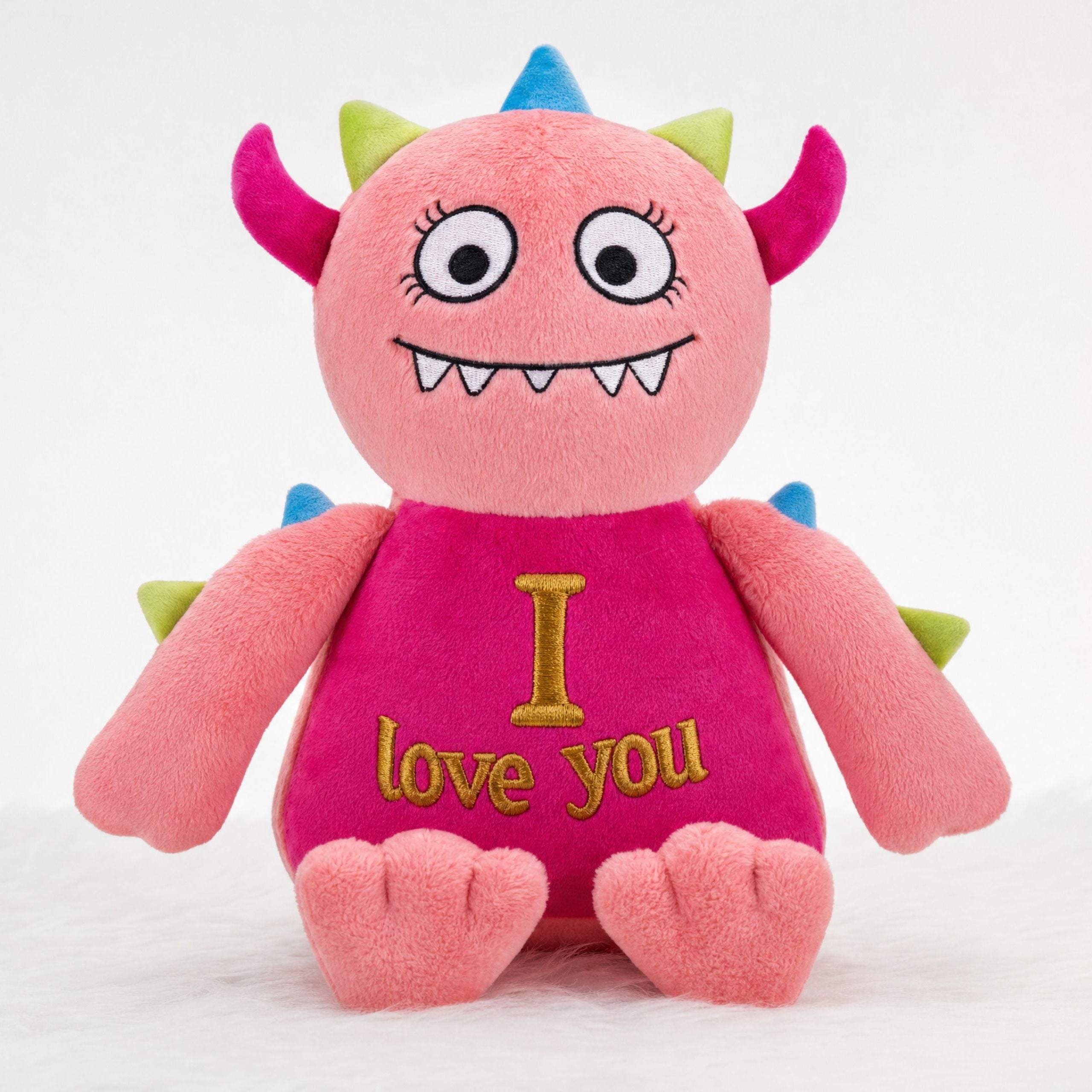 Personalised pink monster plush toy Monty with embroidered name, front view
