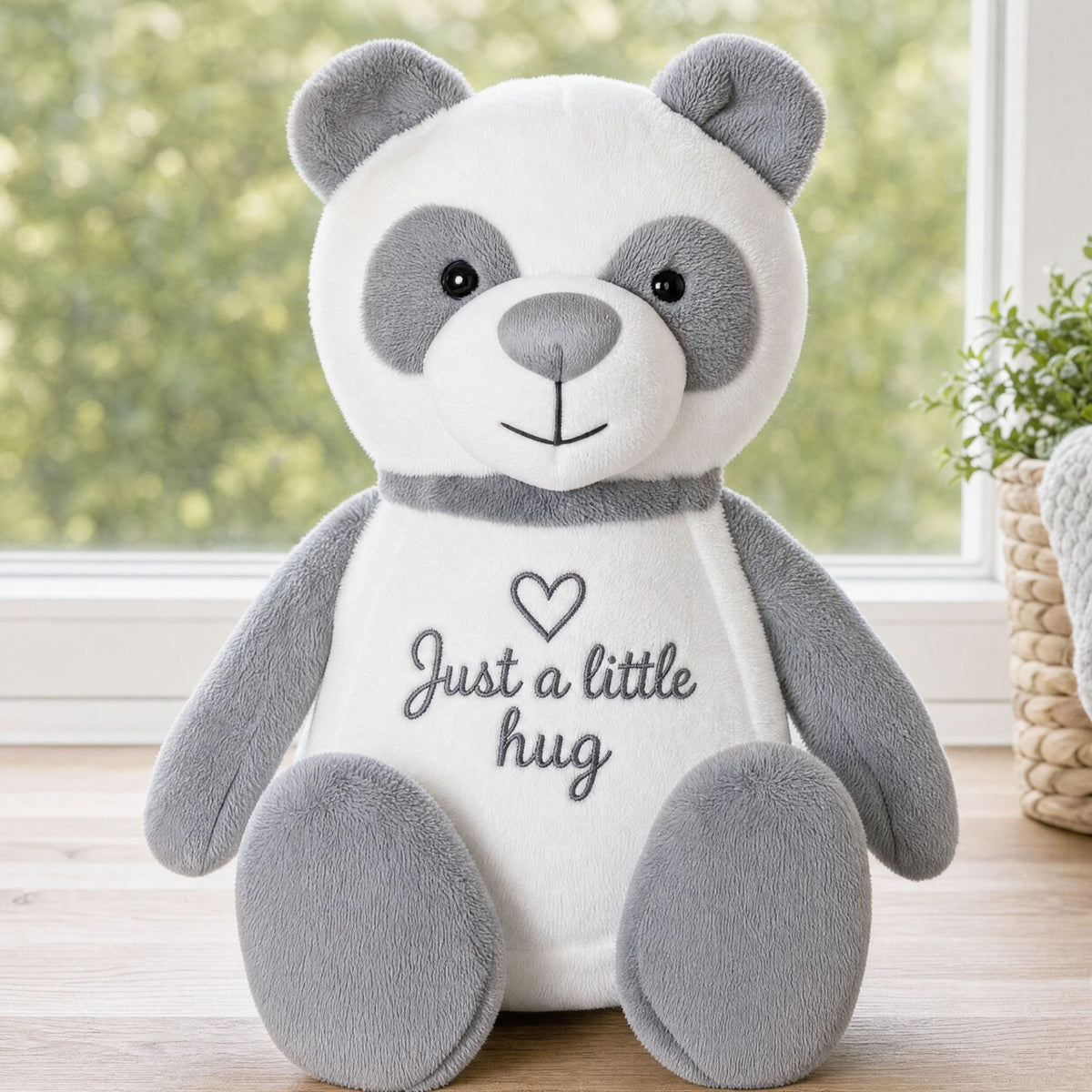 Chester personalised panda plush sitting on a windowsill, soft panda teddy bear with custom embroidery