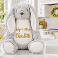 Nodle personalised plush bunny sitting on an Easter table in a kitchen