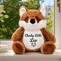 Percy personalised plush fox sitting on a windowsill in a child's bedroom