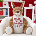 Close-up of Bommer personalised plush kangaroo with embroidered name sitting on the floor