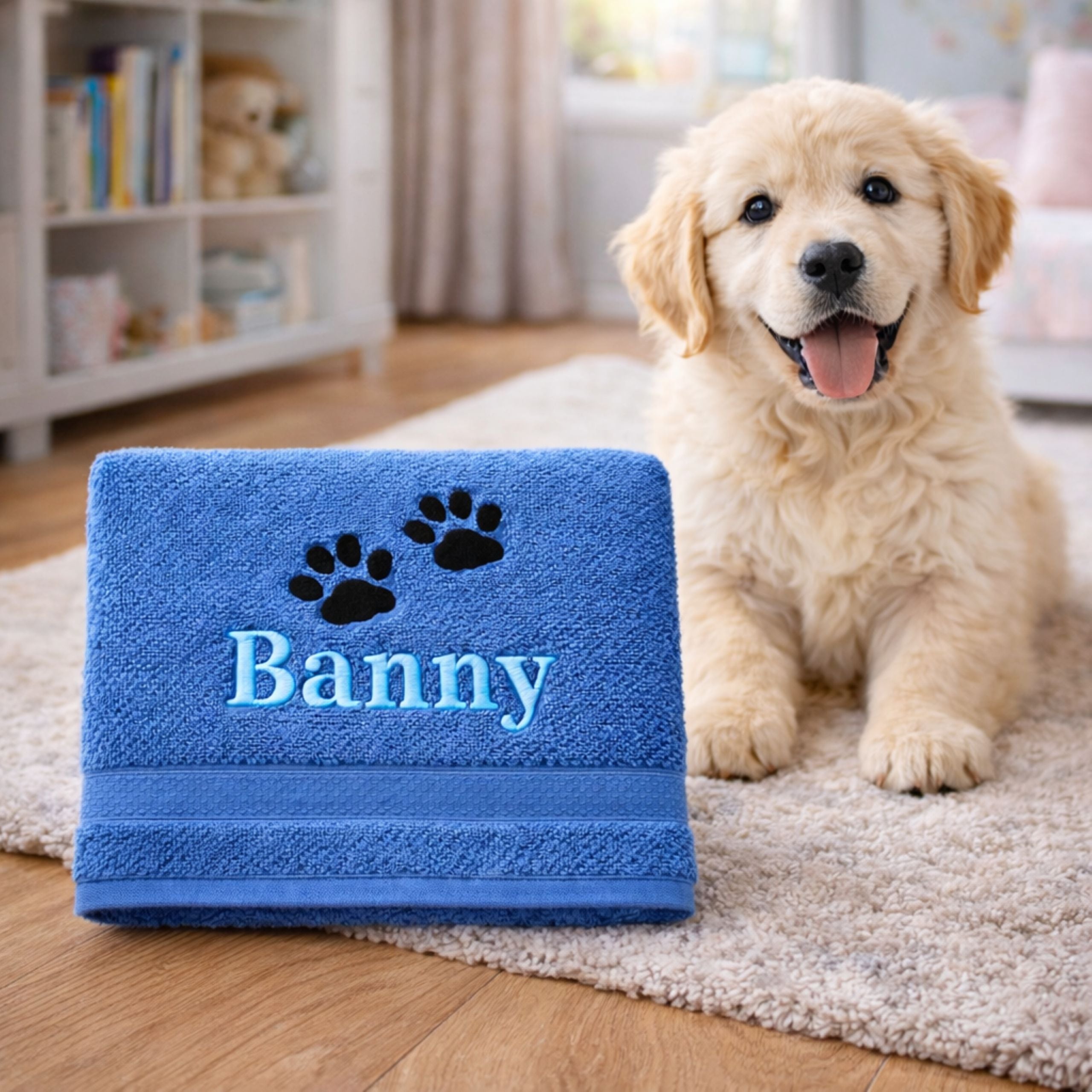 Stacked personalised dog towels with embroidered names and paw prints