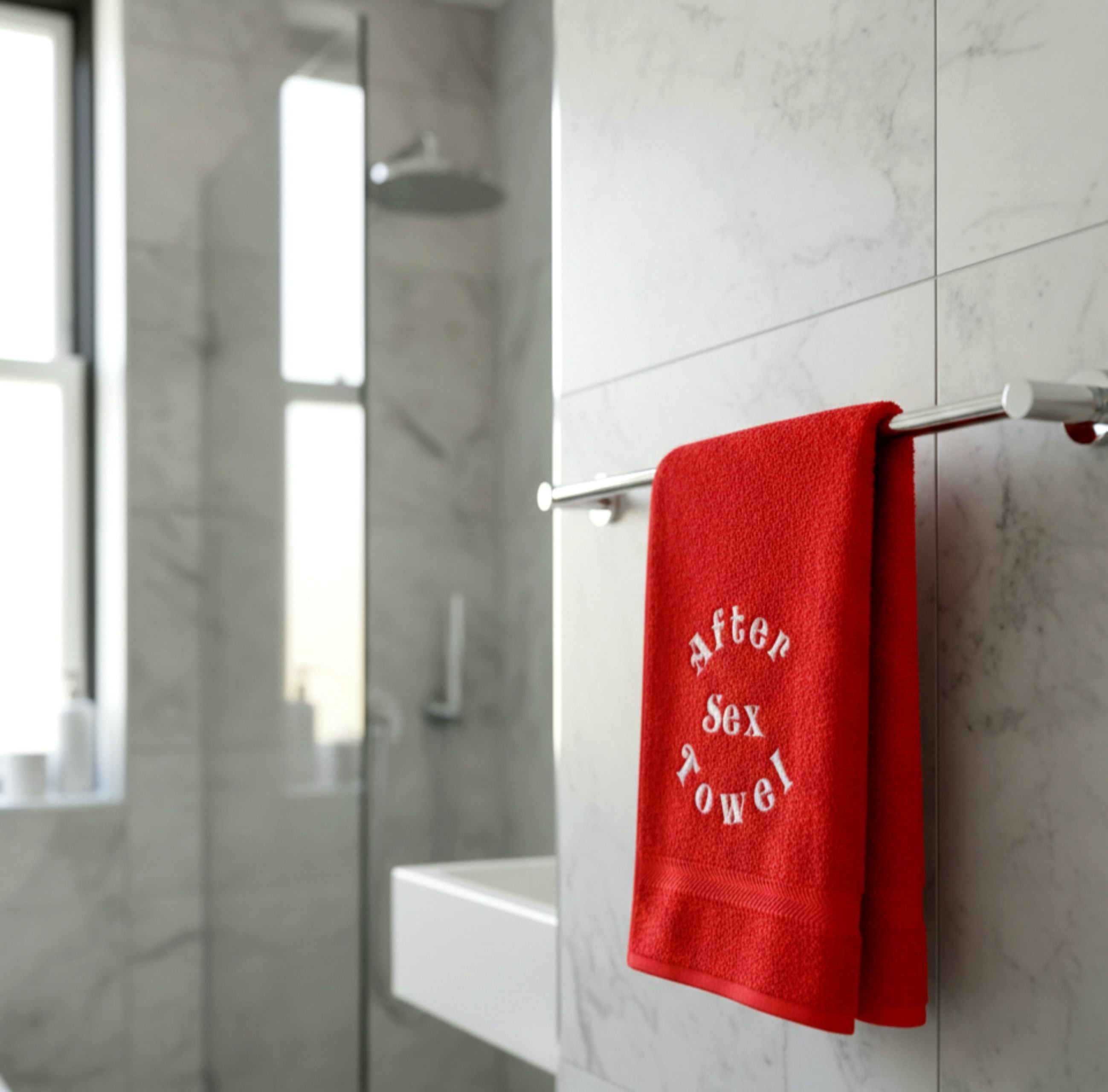 Soft cotton towel hanging on a bathroom hook, indoor bathroom interior