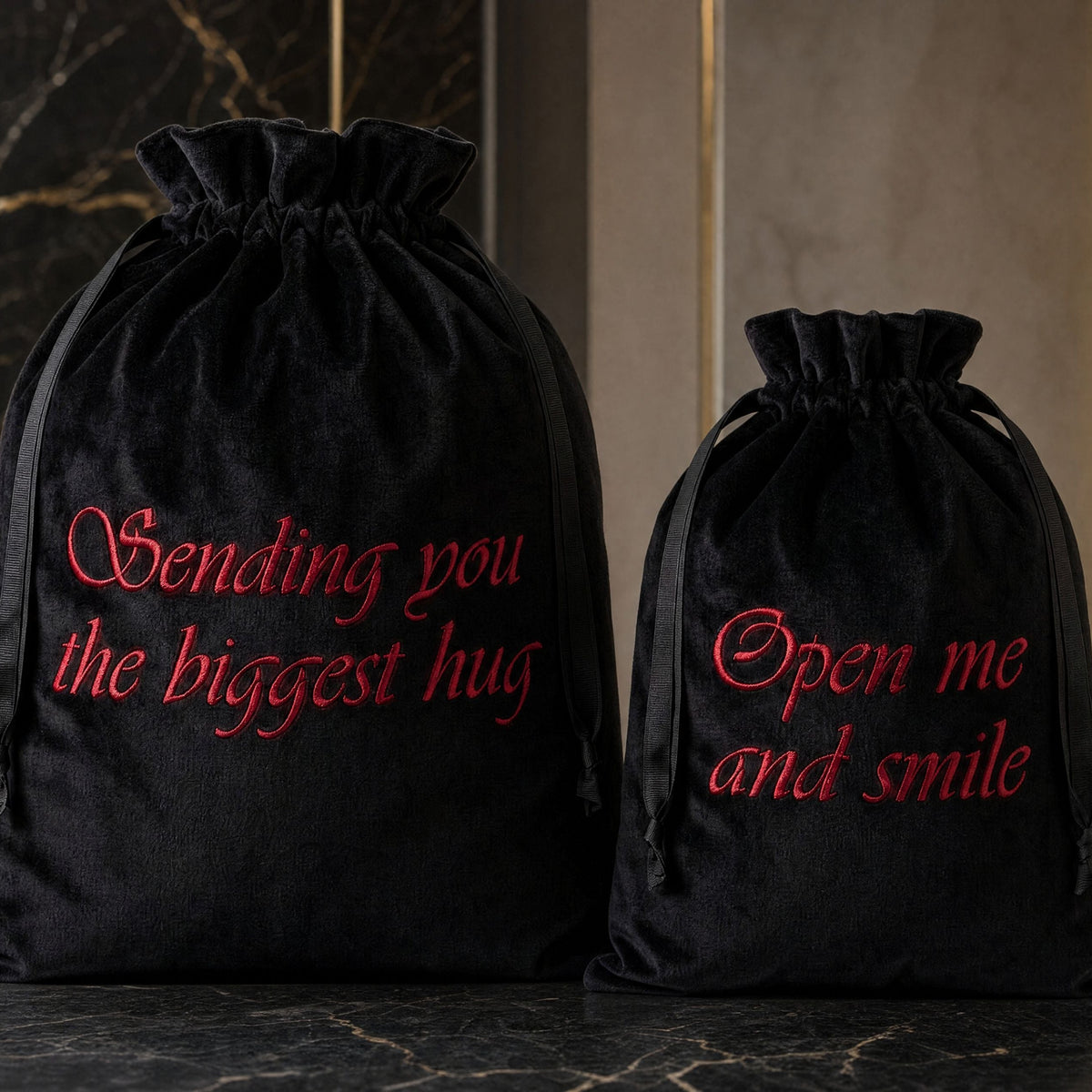 Black velvet drawstring gift bag with personalised embroidered message, elegant reusable bag for special gifts