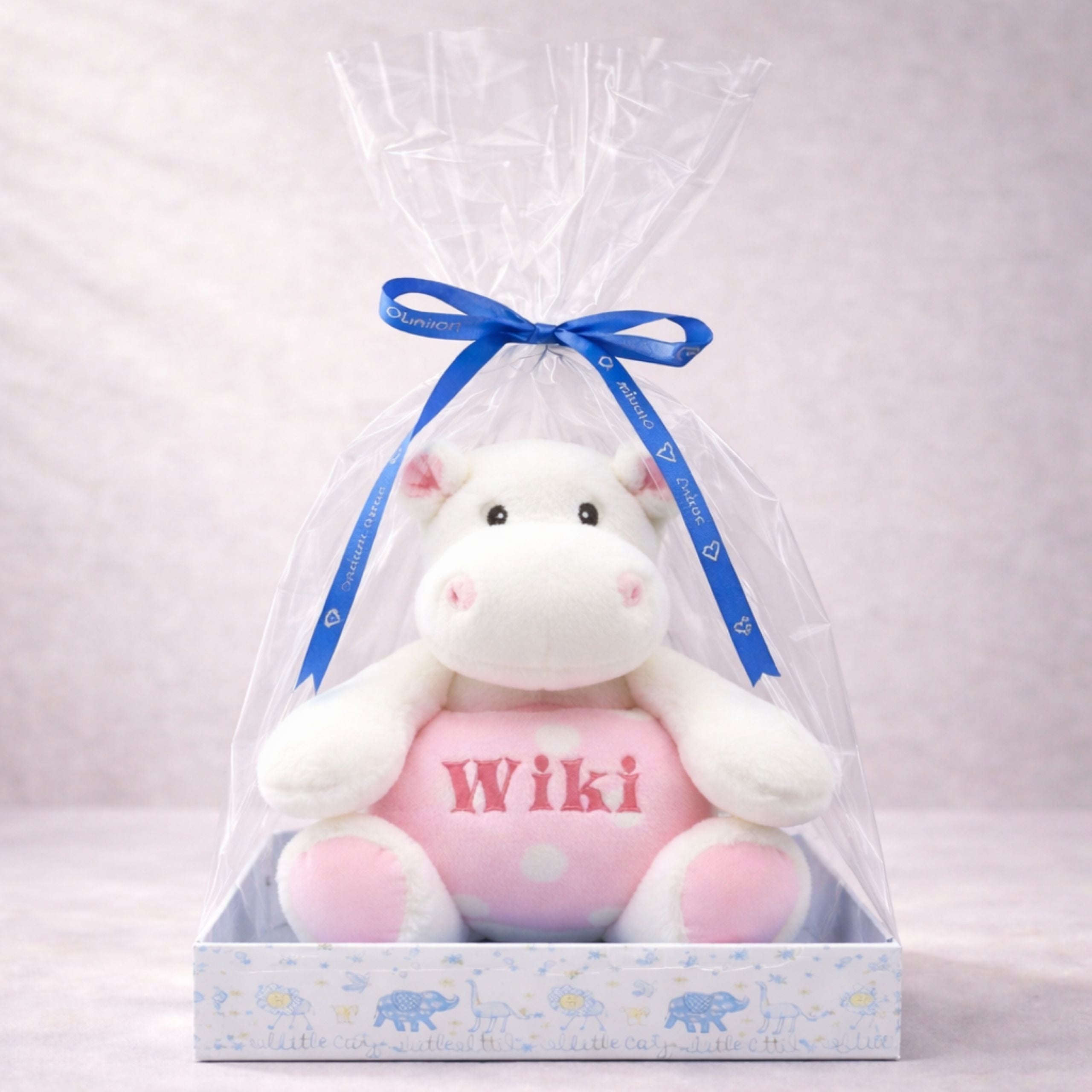Blue plush hippo toy with Wiki embroidery in a blue gift package with ribbon