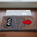 Handmade tufted keyboard rug featuring cheerful cartoon monkey wearing a tie