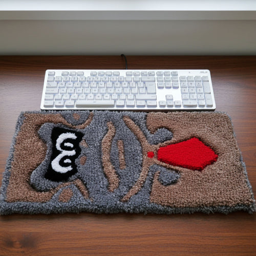 Handmade tufted keyboard rug featuring cheerful cartoon monkey wearing a tie