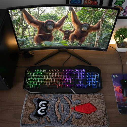 Monkey with Tie handmade tufted keyboard rug placed under computer keyboard
