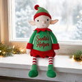 Personalised Christmas elf Jolly sitting beside a festive Christmas window