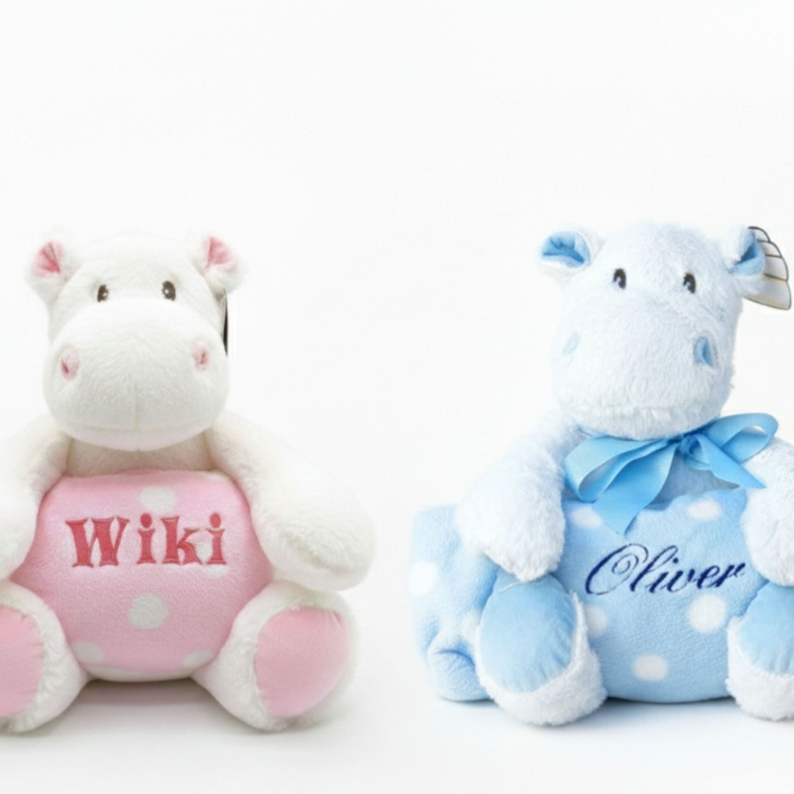 Personalised pink and blue hippo with fleece blankets sitting on floor baby gift set