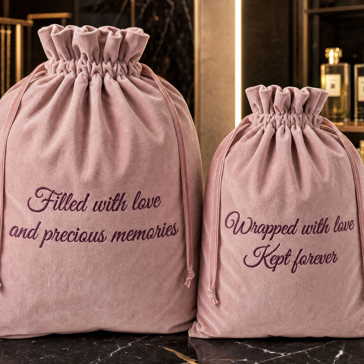 Rose Quartz pink velvet gift bag personalised with embroidered text and finished with a matching ribbon drawstring