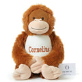 Child playing with personalised plush orangutan Jasper alongside gorillas