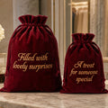 Ruby red velvet drawstring gift bag with custom embroidered text, personalised reusable gift packaging