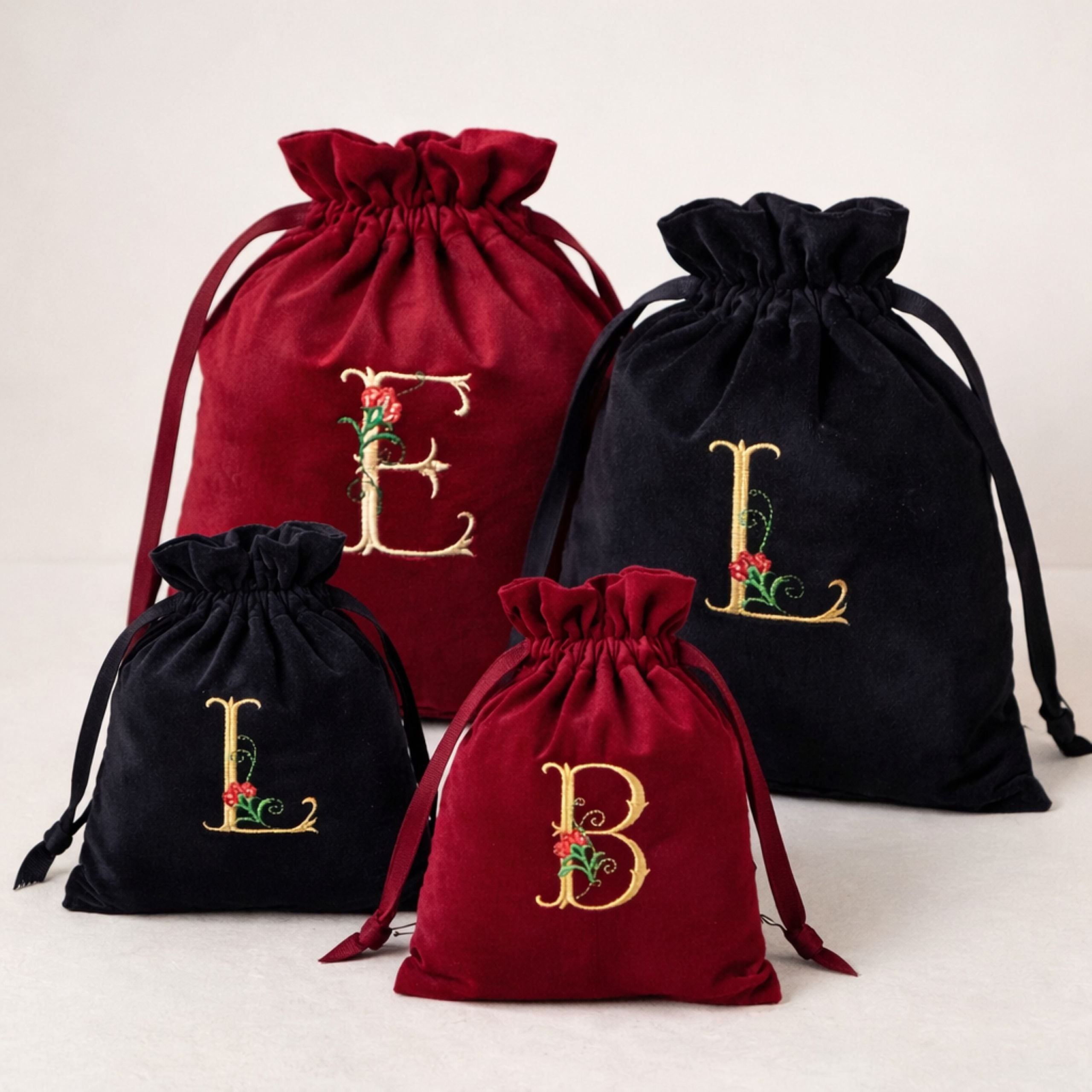 Personalised velvet gift bag with custom embroidered initial close up detail