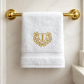 personalised embroidered towel hanging on rail