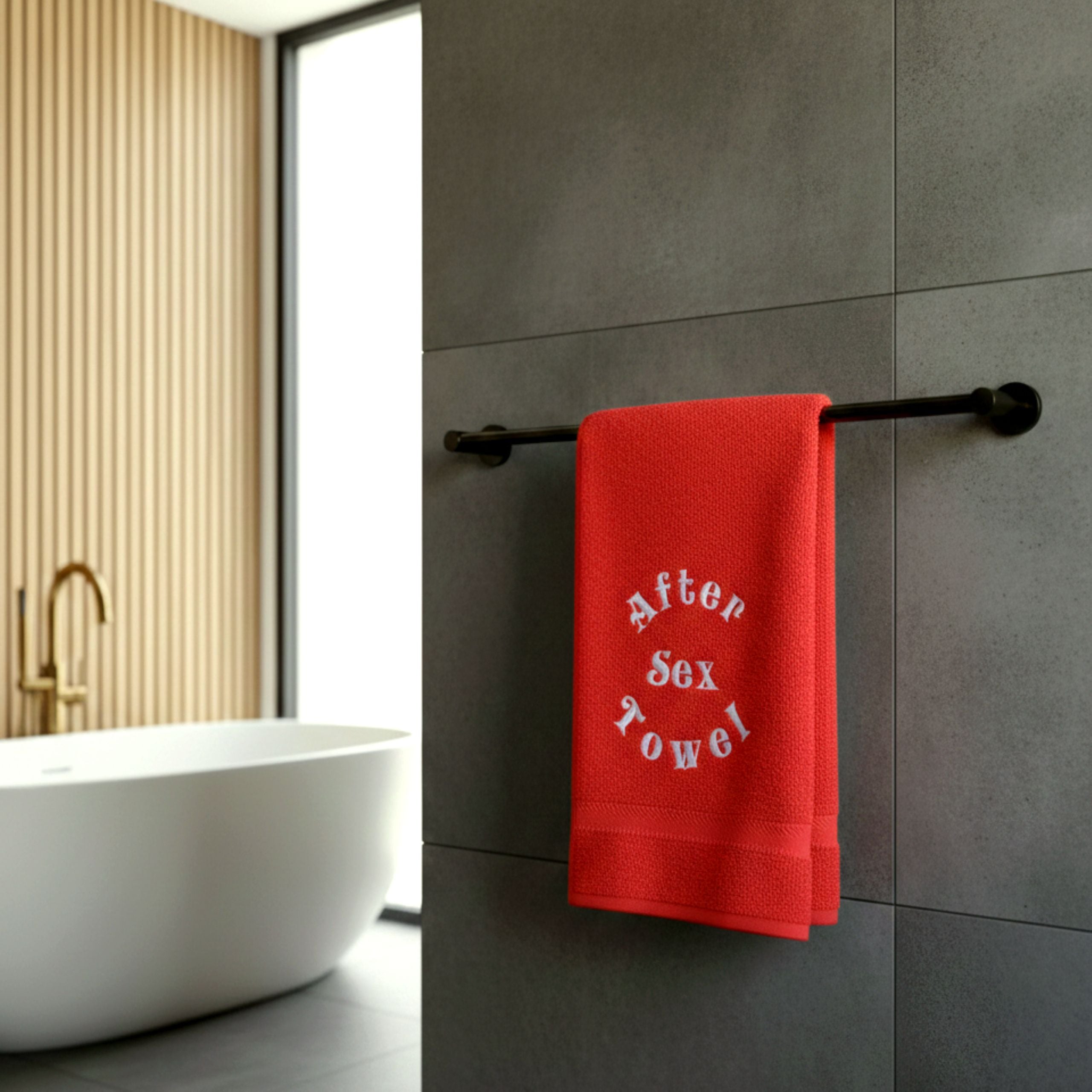 Soft cotton towel hanging on a bathroom hook, indoor bathroom interior