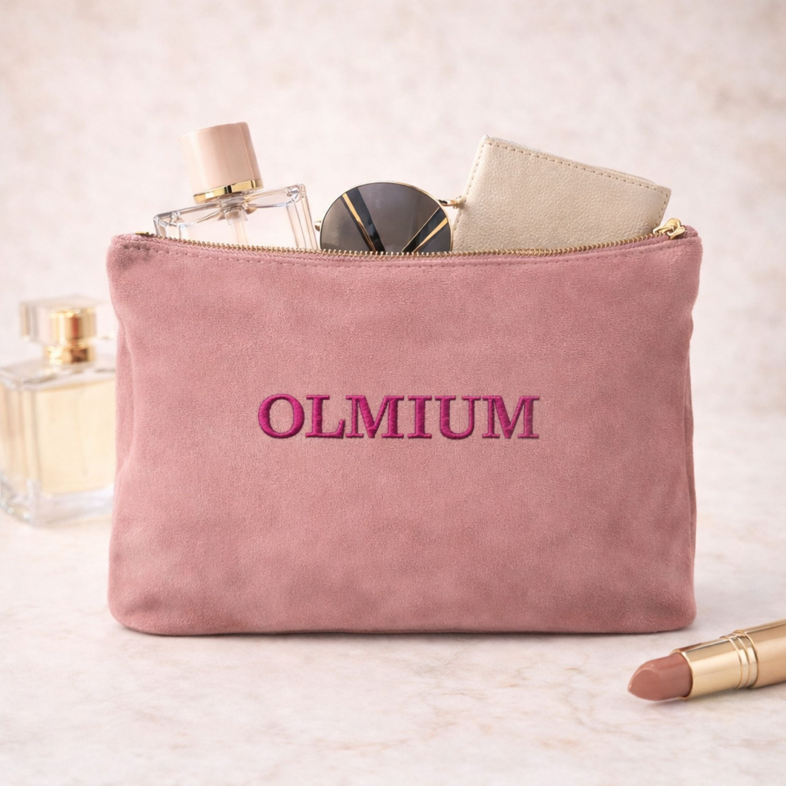 Front view of personalised velvet accessory bag embroidered with metallic thread