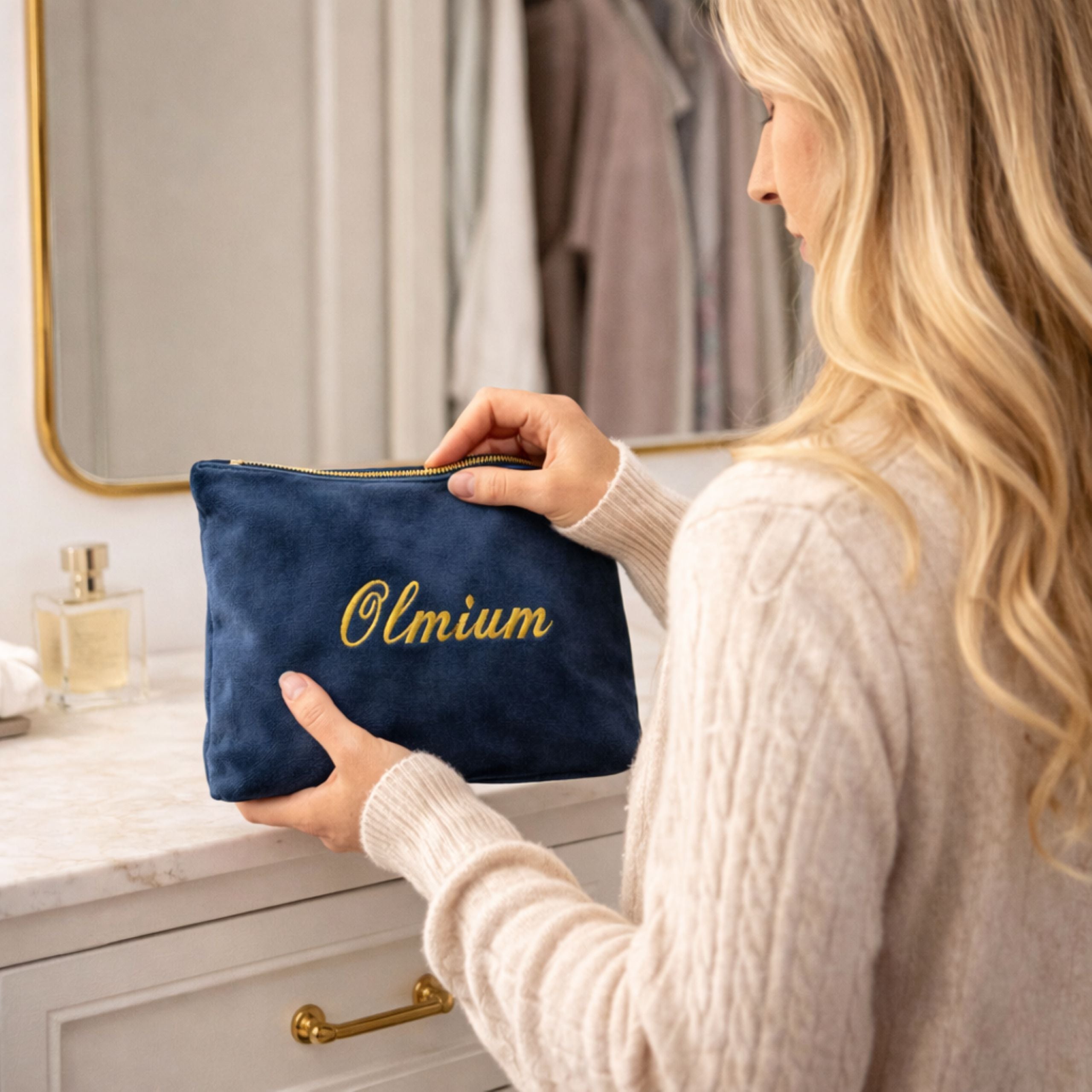 Lifestyle image of woman holding personalised velvet makeup and jewellery bag