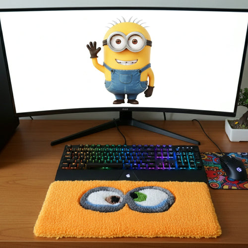 Yellow eyes handmade tufted keyboard rug placed under computer keyboard
