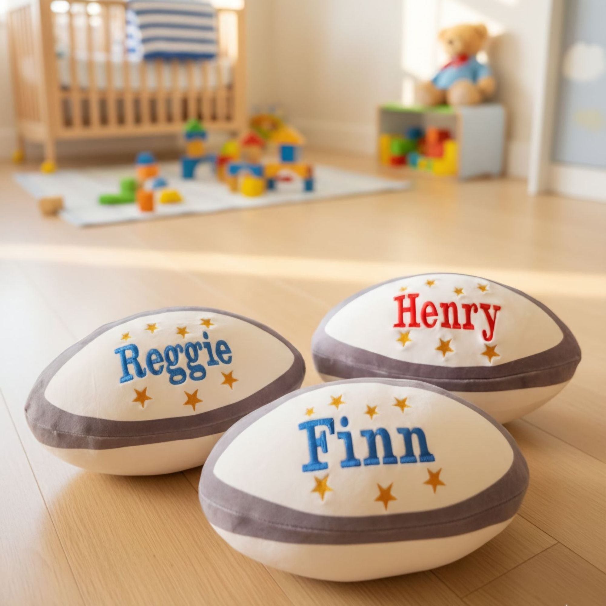 Kids enjoying personalised Zippy plush rugby balls with custom embroidered names and stars